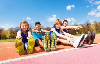 A multicultural group of school kids in a classroom